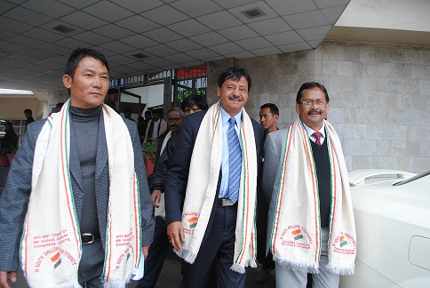 Congress candidate Manas Chaudhuri flanked by his supporters after filing his nomination papers. Pix by WT Lyttan