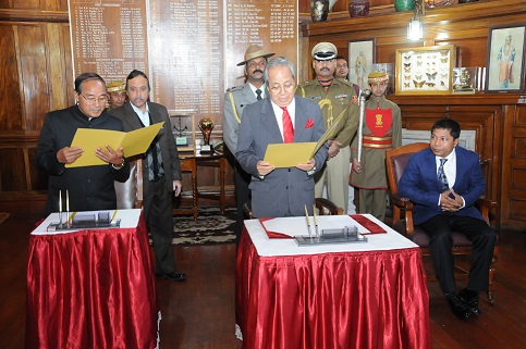 Rowell Lyngdoh being administered the oath of office as pro-term speaker by Governor RS Mooshahary as CM Mukul Sangma looks on. MIPR pix