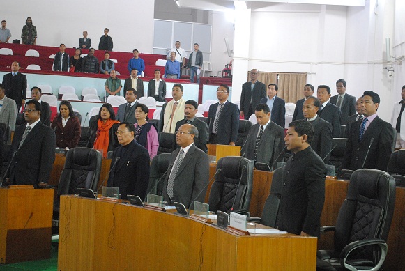 The newly elected members of the ninth Meghalaya assembly standing up during the national anthem inside the Meghalaya assembly. Pix by WT Lyttan