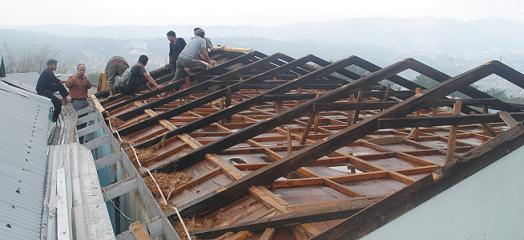 People trying to fix their houses roof that was up rooted on Thursday night Cyclone at Lapalang at the outskirt of Shillong.